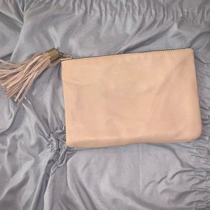 Nude clutch with tassel